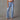70er Jahre Stil hellblaue hohe Taille ausgestellte Schlagjeans für Damen, aus Denim mit auffälligem elektrischen Blauton, betont die Taille und Oberschenkel mit Taschen und ausgestelltem Schnitt ab dem Knie.