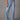 Hellblaue Jeans im 70er Jahre Stil mit hoher Taille und weitem Bein, aus Denim-Material mit Taschen.