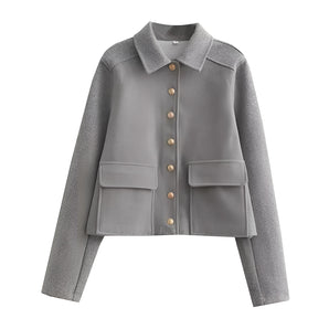 Chic Damen metallic blazer in silver grey, featuring a glittery finish, long sleeves, a structured collar, and button-up front.