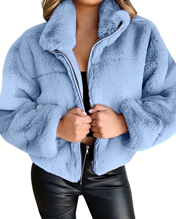 
A blue zip-up teddy jacket made from soft fleece material, featuring a high collar. The jacket is worn by a person and is designed for plus-size wear, specifically in 5XL.