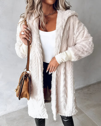 Blush pink teddy coat for women made from faux fur, showcasing a cozy and stylish winter outerwear design with long sleeves and a soft texture.