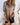 A metallic silver blazer designed for women, styled as a fashion party jacket, in a large 5XL size, featuring a combination of silver shades with brown undertones. The blazer includes details such as a structured collar, long sleeves, and a tailored waist, highlighting the shoulder and neck area, suitable for elegant occasions.