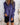 
A model wearing a metallic silver blazer with a fashionable party style, featuring a purple hue and tailored for a plus-size fit, specifically 5XL. The blazer has structured shoulders, long sleeves, and a dress shirt neckline, suitable for party or formal occasions.