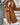 Long brown teddy coat for women in a fashionable winter style, featuring a cozy and warm design with a focus on outerwear. The coat has a classic overcoat cut with long sleeves, suitable for cold weather. The color appears as a coffee shade, providing a stylish and versatile look for winter attire.