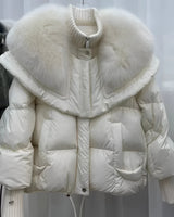 Beige designer women's winter jacket with a fur collar, featuring a grey down coat style, highlighting sleeves and fashion design elements made from natural materials.