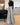 
A pair of wide-legged gold sequin pants designed for elegant evening wear, displayed on a mannequin in a fashion setting.