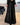 Goldene, weit geschnittene Pailletten-Hose in Schwarz, Größe 5XL, präsentiert auf einem hellen Untergrund, geeignet für elegante Abendveranstaltungen.