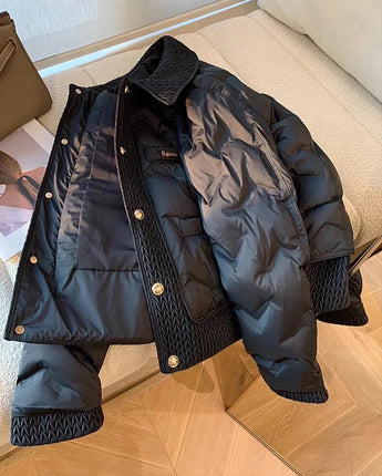 Navy luxury quilted men's jacket with high collar, featuring long sleeves and side pockets, designed for winter wear.