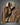 Brown corduroy jacket with a vintage design, featuring Sherpa lining for warmth. The jacket in the image has a button-up front, long sleeves, and a collar. It includes pockets for added functionality. The jacket is in a coffee color and is shown in a 4XL size, ideal for winter wear.