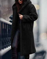 
A long black teddy coat for women in XL size, featuring a fluffy texture and designed for winter fashion. The coat resembles an overcoat or trench coat style, highlighting areas such as shoulders, neck, sleeves, waist, knees, and thighs.