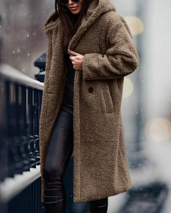 
A long, khaki teddy coat for women in size XL, featuring a plush texture ideal for winter fashion. The coat has a classic overcoat design with a collar, full-length sleeves, and a waist-length fit, providing warmth and style.