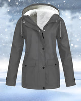 
A gray women's waterproof winter parka in size 4XL featuring a fur-trimmed hood, designed for insulation and style, with long sleeves suitable for snowy and cold weather conditions.